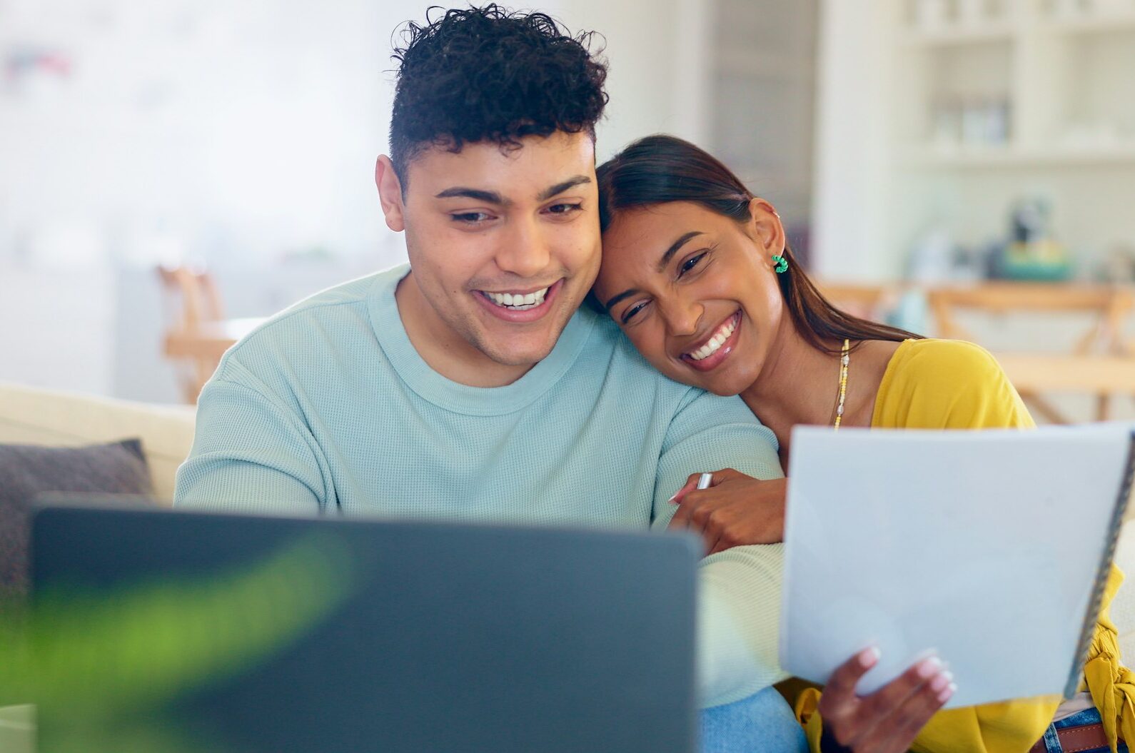 Online, investment and couple in home with laptop and paperwork for loan, mortgage or real estate.